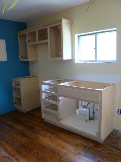 installed light ash kitchen cabinets